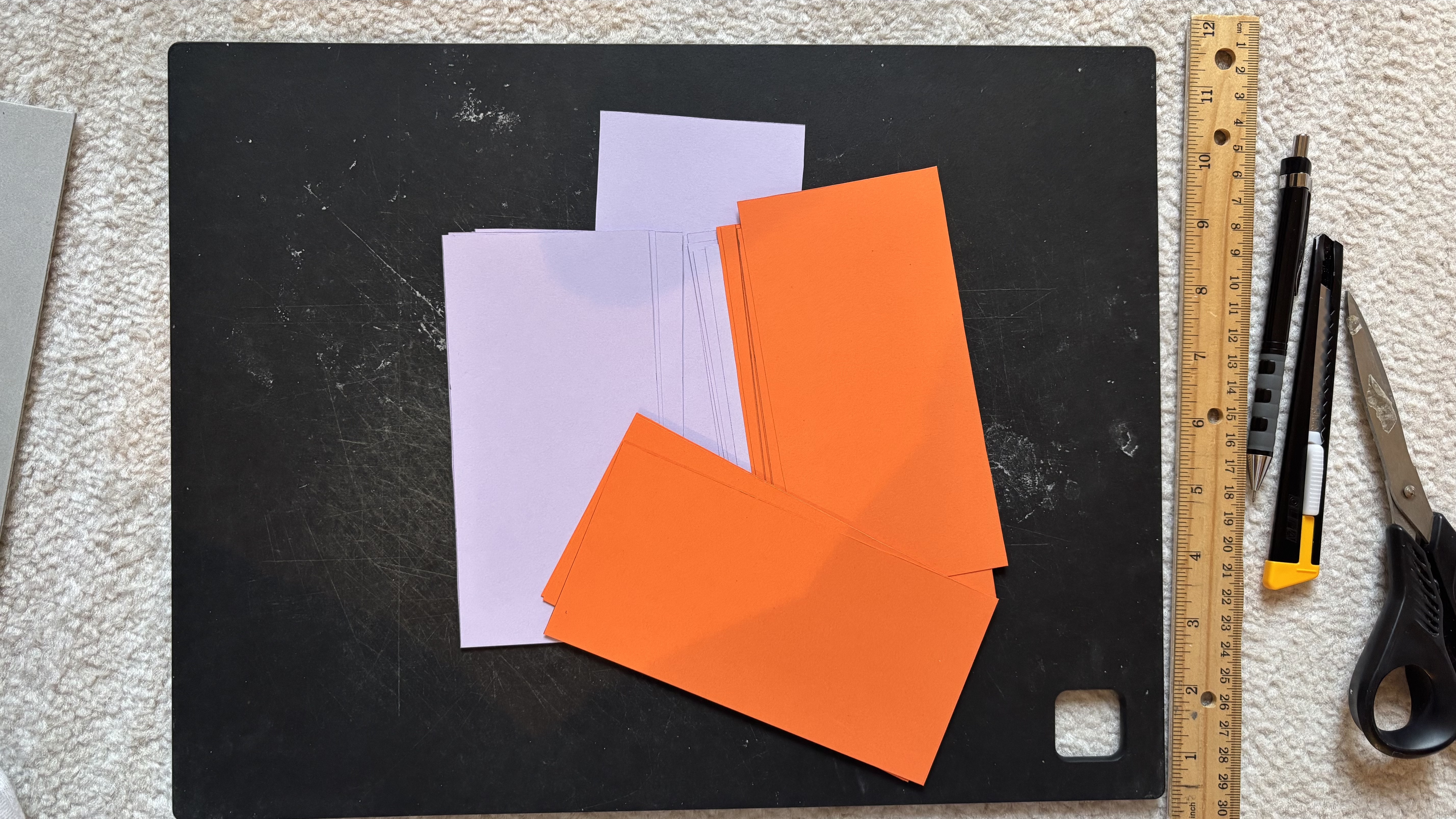 Preparing colored paper flags for the accordion spine