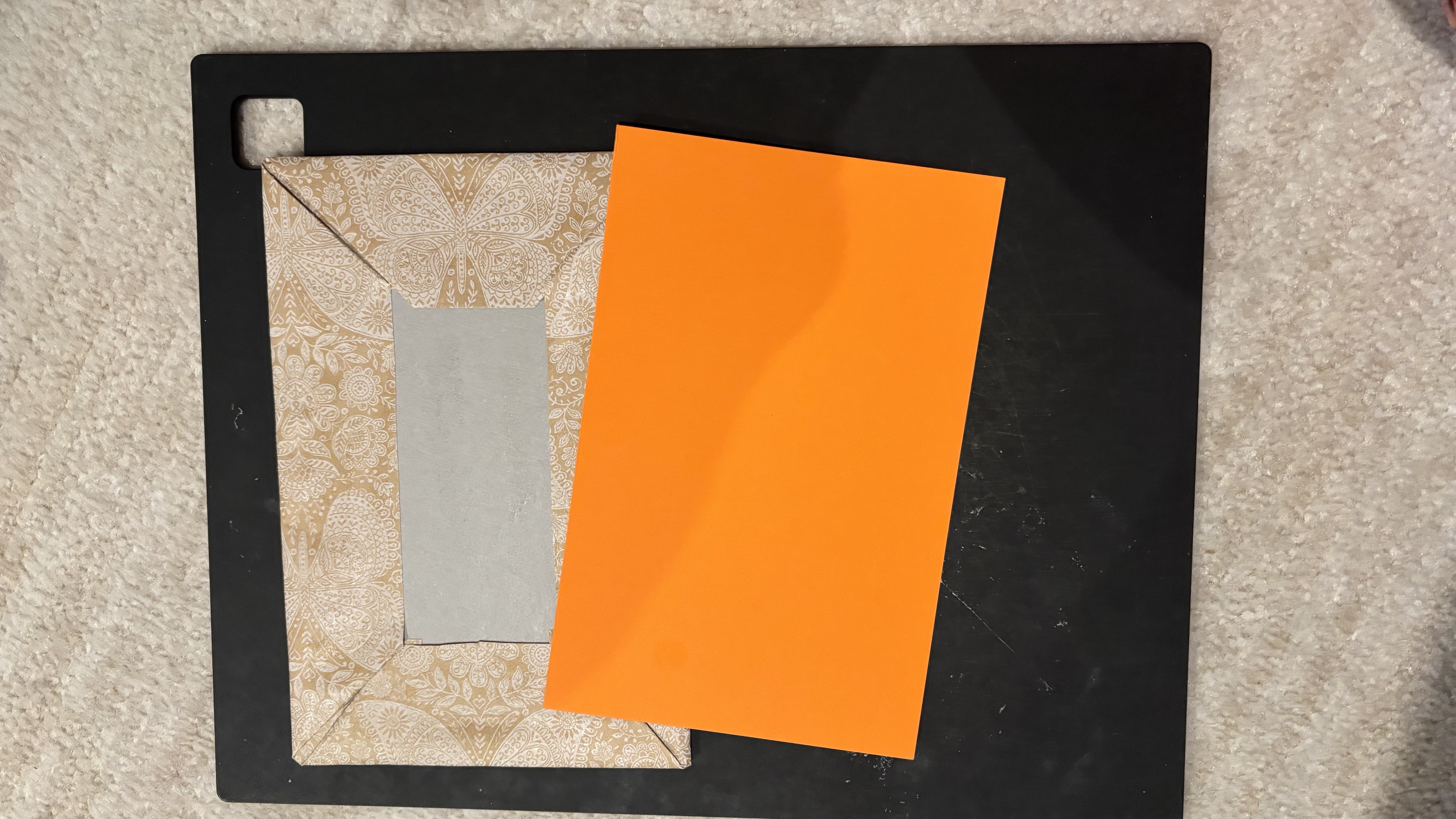 Covering the inside of the book cover with colored paper